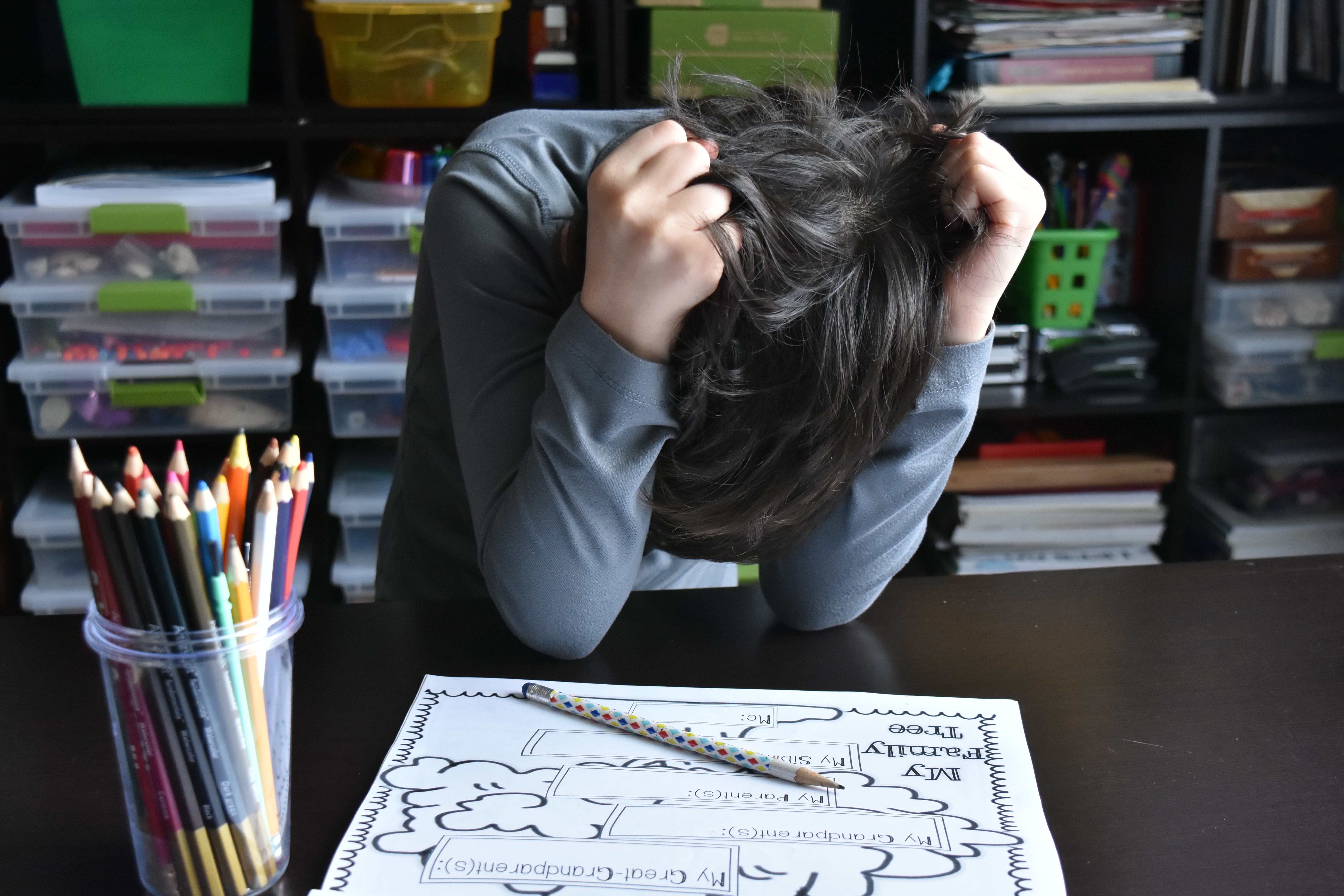 An exhausted teacher at a desk