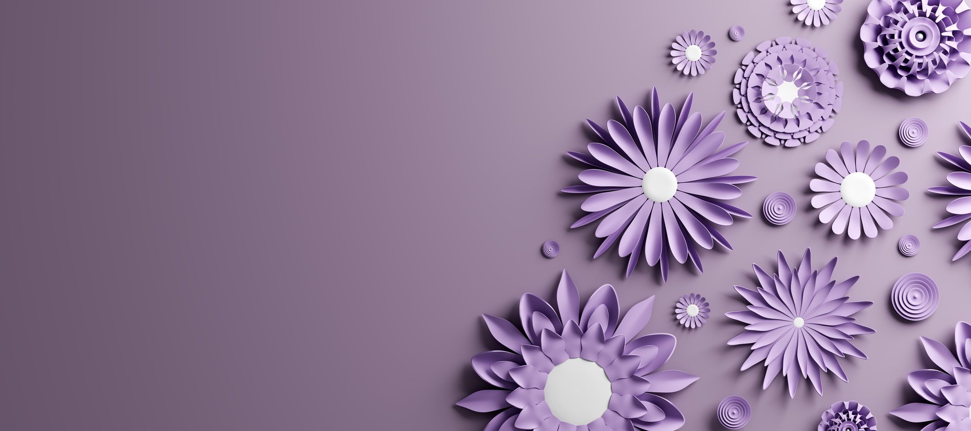 Purple paper flowers blooming on a soft lavender field