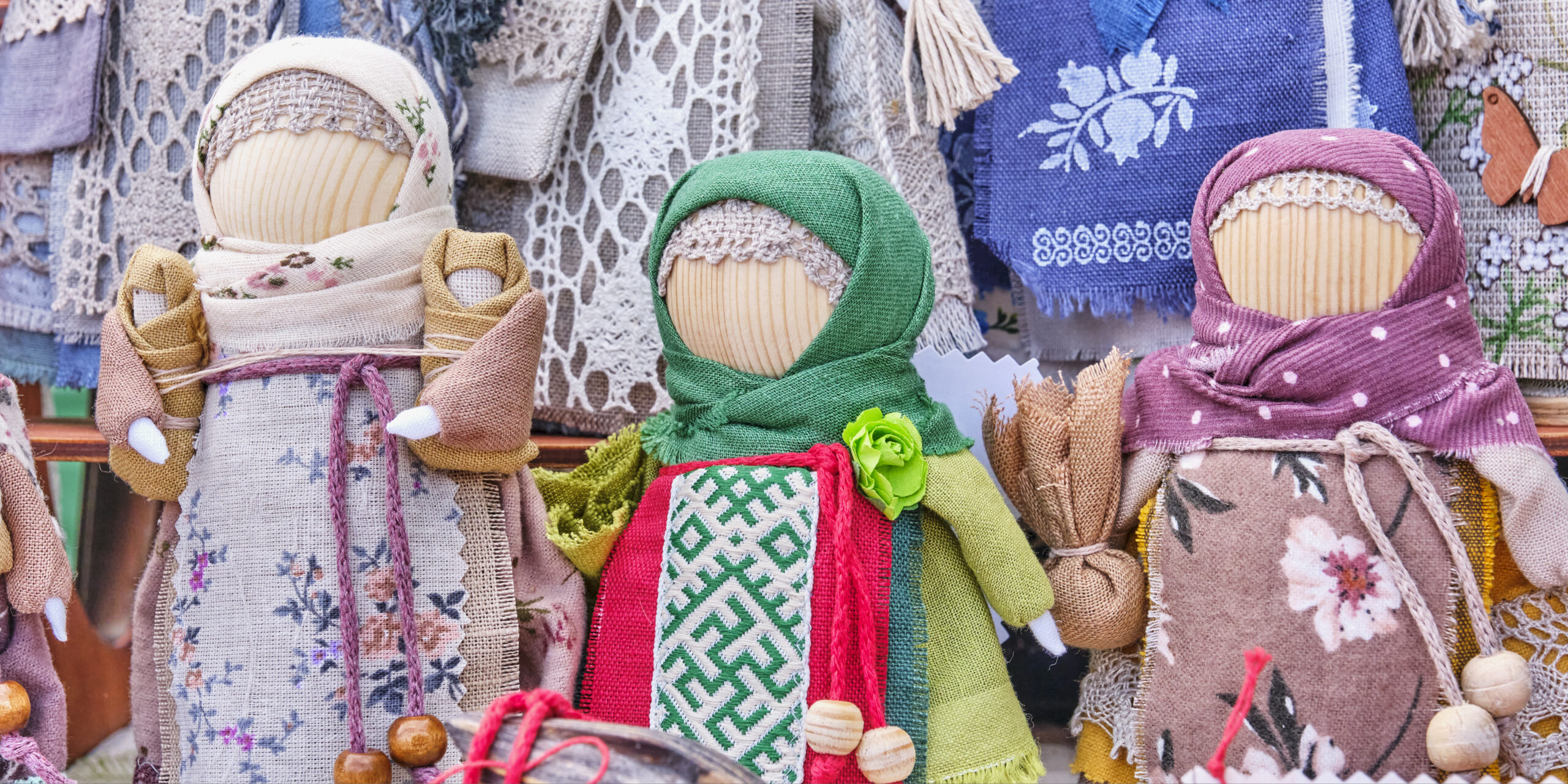 Handmade dolls in traditional dress with accessories