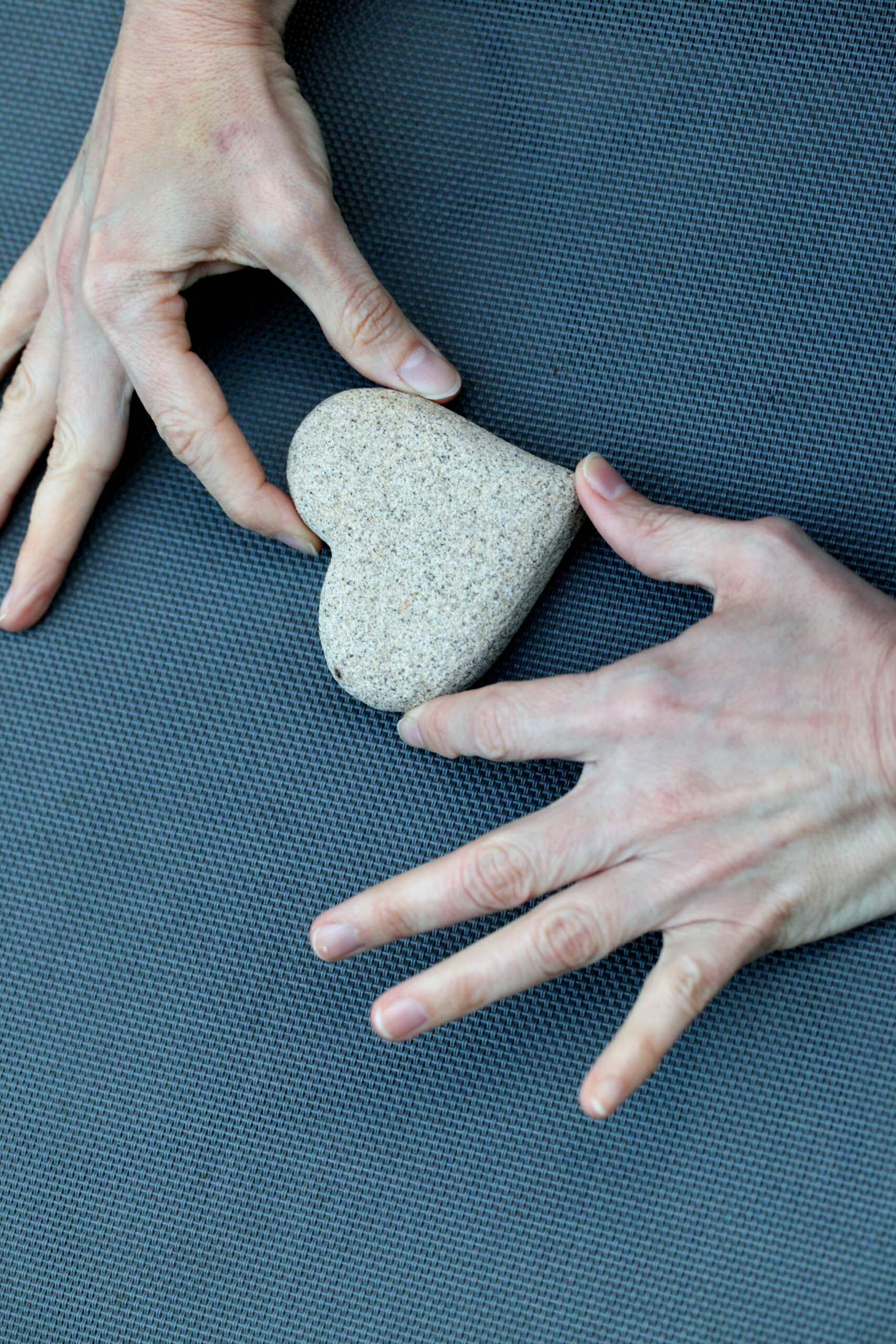Hands holding a heart shape