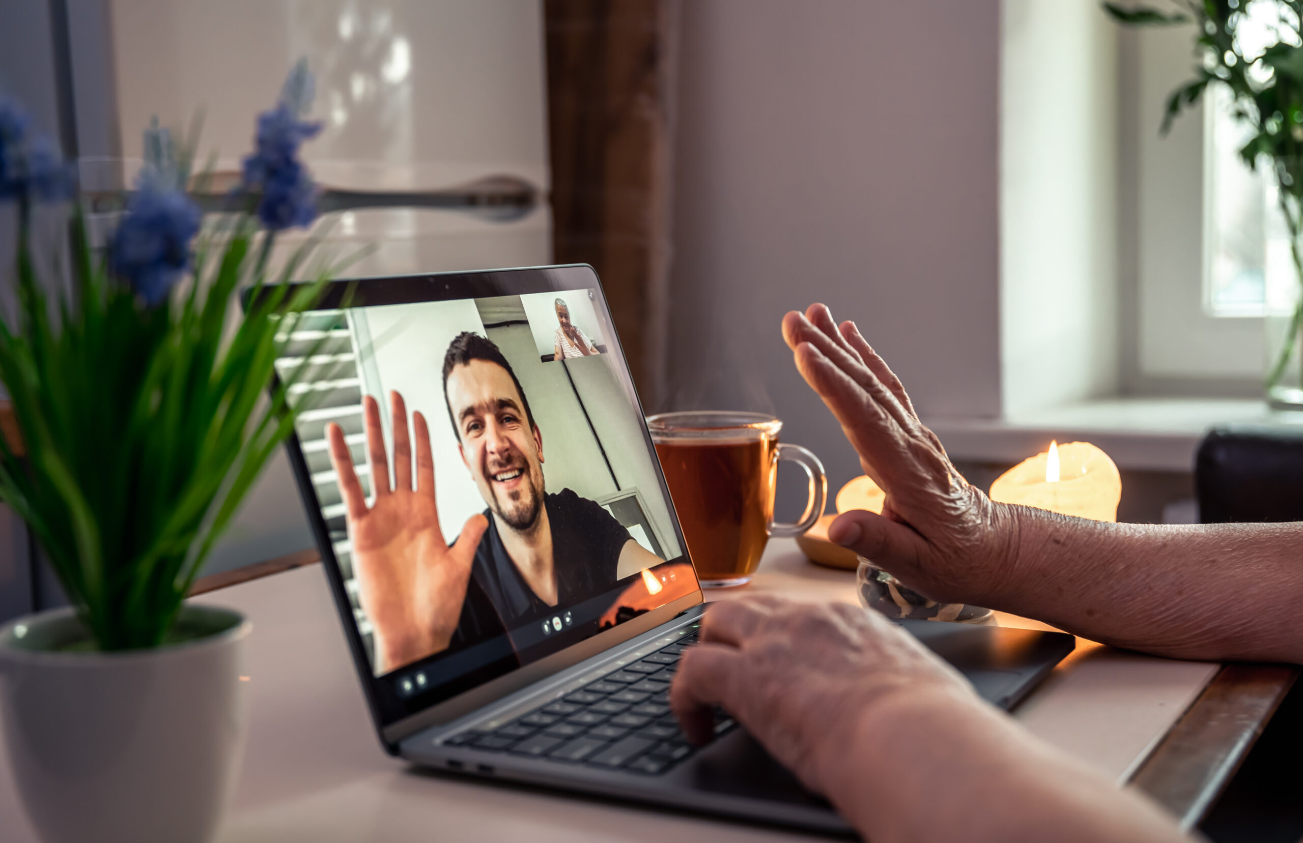 An older adult on a video visit with a family member
